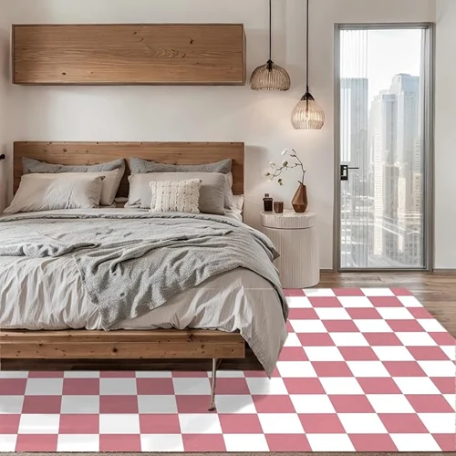 large pink and white checkered rug covering most of the floor in a modern bedroom.