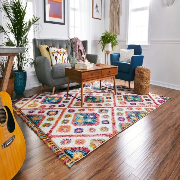 bohemian-style living room with a patterned rug, colorful accents, and plenty of plants.