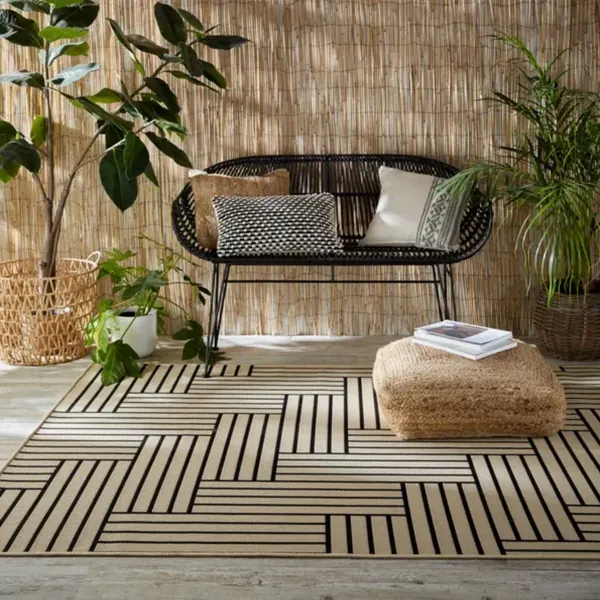 Geometric outdoor carpet, Dubai patio, natural textures, contemporary design.