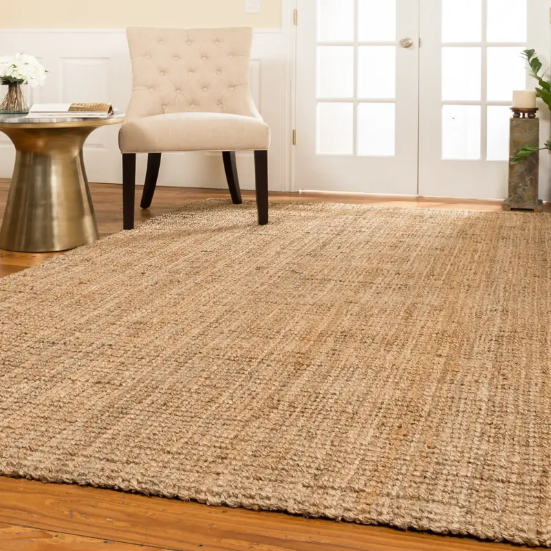 Hand-woven natural jute rug on wood floor